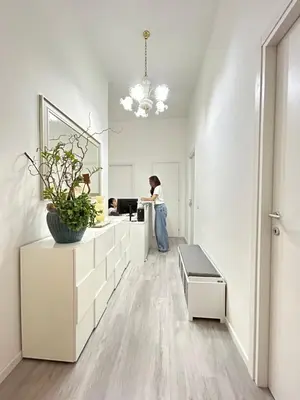 a woman standing in a kitchen with a counter at The house Of Brindisi in Rome