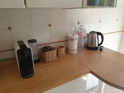 a kitchen counter top with a black appliance on it at Laura's RHome in Rome