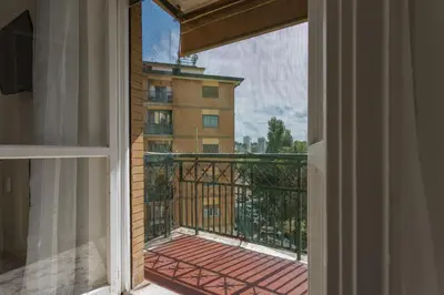 a balcony with a view of a building at Rebecca Apartment in Rome