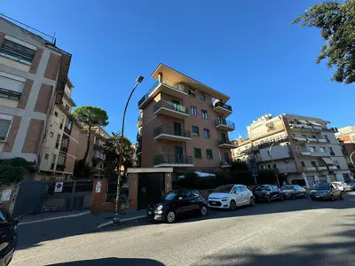a group of cars parked in front of a building at Numiro in Rome