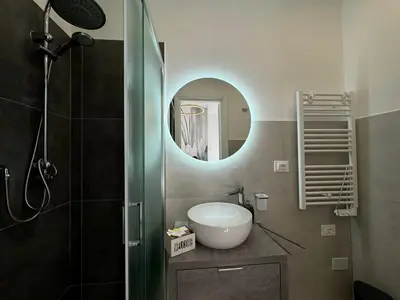 a bathroom with a sink and a mirror at Numiro in Rome