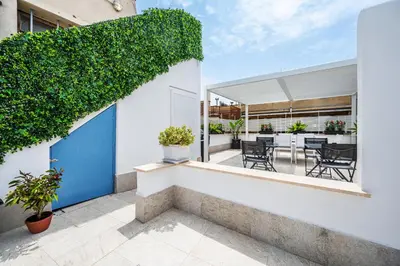 a view of the balcony of a house with a blue door at Colonna Inn in Rome