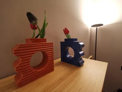 two vases and a mirror on a table with flowers at Auri Vatican apartment in Rome