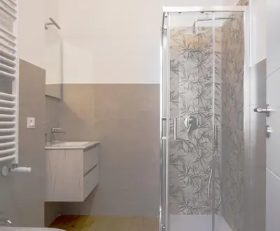 a shower with a glass door in a bathroom at Biffi 2 - Garbatella Rooms in Rome