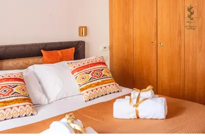 a bedroom with a bed with pillows at Interno Otto con Bellissima Terrazza e Gazebo in Rome