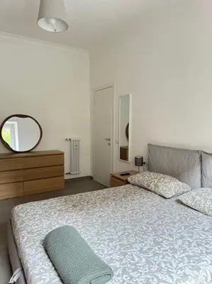 a bedroom with a large bed and a mirror at Re di Roma Metro Hub - Rome Collection in Rome