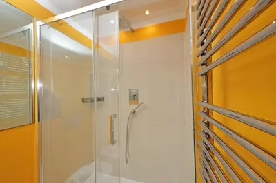 a shower with a glass door in a bathroom at 4BNB - Armot House Vatican Apartment in Rome