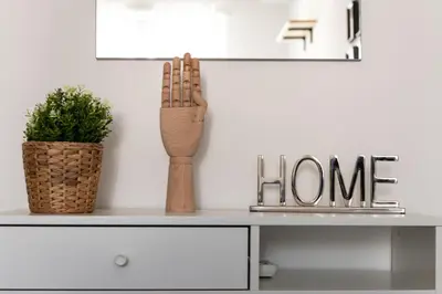 a desk with a plant and a sign that reads home at Sergio i Retreat in Rome