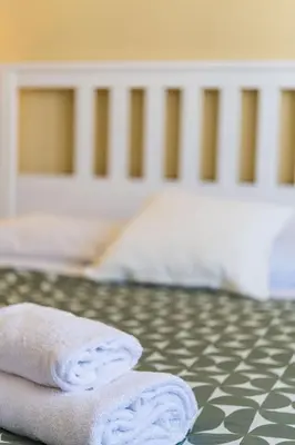 two towels sitting on top of a bed at Sergio i Retreat in Rome