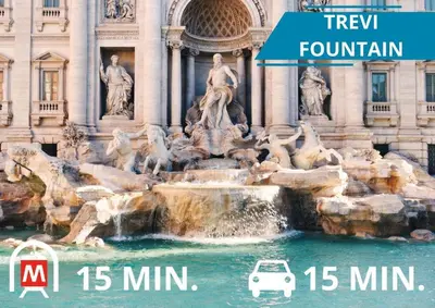 a car parked in front of a fountain in front of a building at NEXUS Palace in Rome