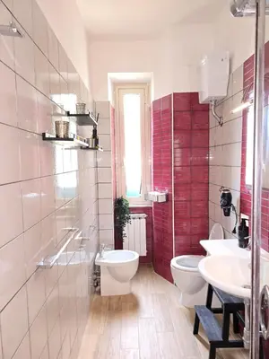 a bathroom with two sinks and two toilets in it at Domus Prestige Vaticano 