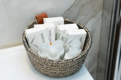 a basket filled with toiletries sitting on a table at La dolce vita Cavour in Rome