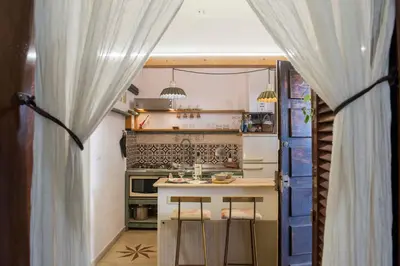 a small kitchen with a table and a stove at Apartment in the center of Rome in Rome