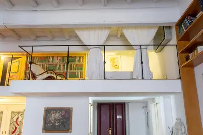 a room with two levels of a room with curtains at Angi's home the new Luxury in Rome heart in Rome
