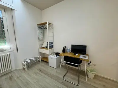 a room with a desk with a computer on it at Malila's-Cipitelli San Pietro in Rome