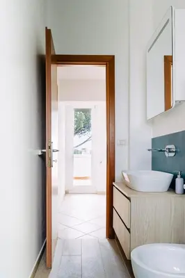 a bathroom with a sink and a mirror at Rooftop Apartment Quadraro in Rome