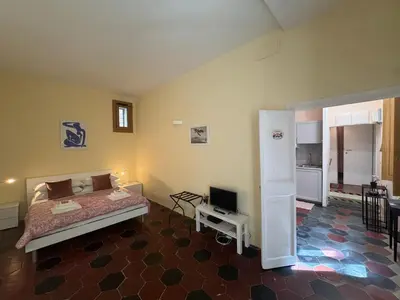 a bedroom with a bed and a television in it at Le Due Torri in Rione Monti in Rome
