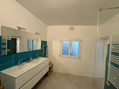 a bathroom with a sink and a mirror at Le Due Torri in Rione Monti in Rome