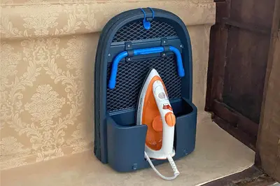 a blue container with a hair dryer in it at La maisonette romana in Rome