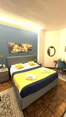 a bedroom with a bed with two towels on it at Trastevere Welcome Home Superior in Rome