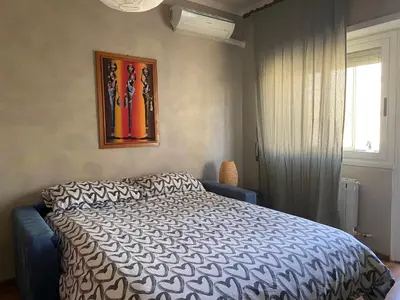 a bedroom with a bed and a window at Interno33 Appartamento accogliente e moderno vicino Stazione Tiburtina in Rome