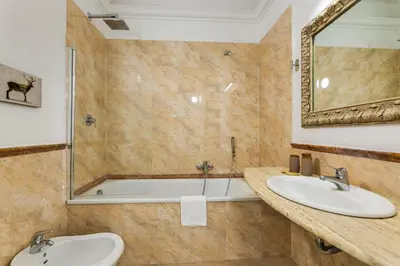 a bathroom with two sinks and a shower at Via Veneto - Dolce Vita Alcova in Rome