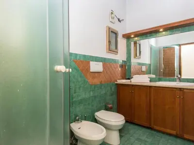 a bathroom with a toilet and a sink at Piazza Navona Charming Apartment in Rome