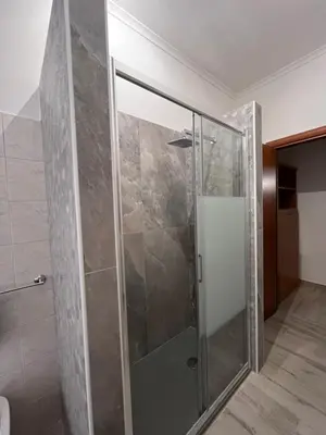 a shower with a glass door in a bathroom at A casa di Pina - Roma St Peter in Rome