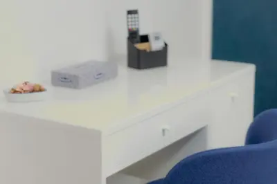 a desk with a blue chair and a box on it at A casa di Pina - Roma St Peter in Rome