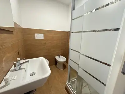 a bathroom with a sink and a toilet at Vaticano Apartment in Rome