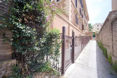an iron fence in front of a building at Clivo 2 St Peter BuddyRent in Rome