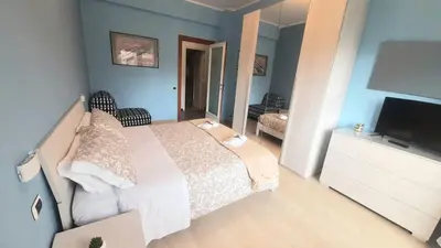 a bedroom with two beds and a wooden floor at VIVA Rome Apartment 