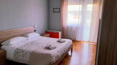 a kitchen with a long table with white plates on it at VIVA Rome Apartment 