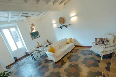 a living room with a couch and a table at Domus Superior Domizio - Pantheon in Rome