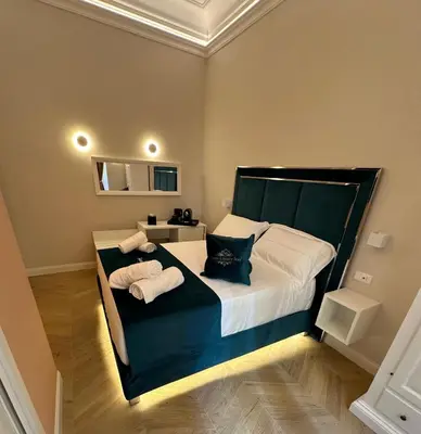 a bedroom with a large bed with towels on it at Roma Luxury Stay 56 in Rome