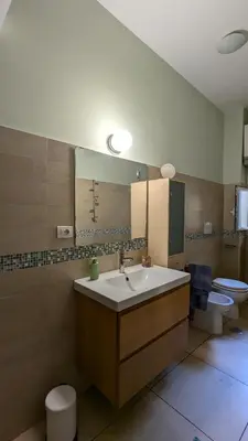 a bathroom with a sink and a toilet at Appartamento C9 in Rome