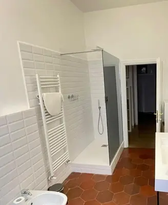 a bathroom with a shower with a toilet and a sink at Camera matrimoniale Roma Centro Vaticano in Rome