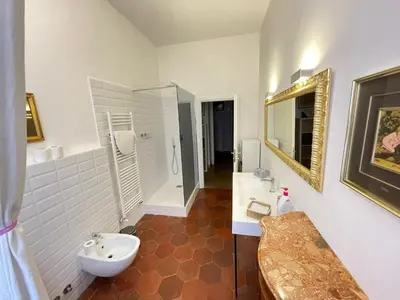 a bathroom with a toilet and a glass shower at Camera matrimoniale Roma Centro Vaticano in Rome
