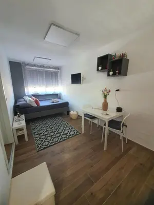 a living room with a couch and a table at Monteverde Rhome in Rome