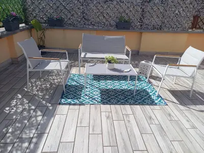 two chairs and a table on a patio at Monteverde Rhome in Rome