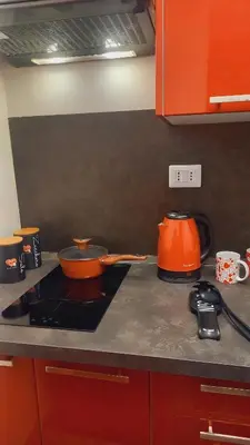 a kitchen counter with two pots on a stove at Monteverde Rhome in Rome