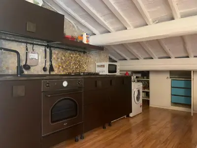 a kitchen with a stove and a stove top oven at G&A Rome House in Rome
