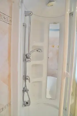 a shower in a bathroom with a mirror at Domus St Peter in Rome