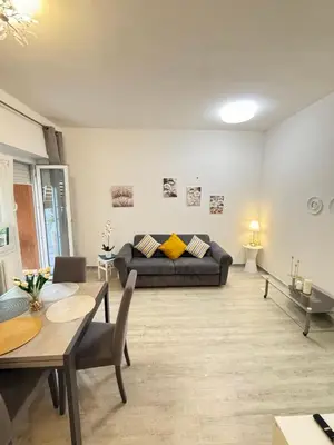 a kitchen with a sink and a refrigerator at La Casa di Aimara in Rome