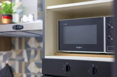 a television sitting on a shelf in a room at Amora Apartments in Rome