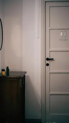 a white door in a room with a desk at Betty House Roma in Rome