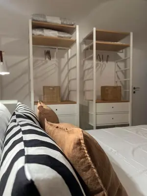 a bedroom with a bed with pillows on it at Civico26 in Rome