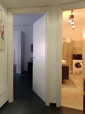 a room with a bathroom with a toilet and a door at Un angolo di Oriente a due passi da San Pietro in Rome