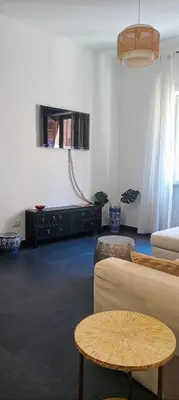 a living room with a couch and a table at Un angolo di Oriente a due passi da San Pietro in Rome