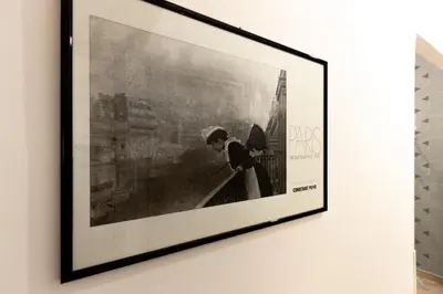 a framed picture of a woman on a wall at Cozy Retreat Saint John in Rome